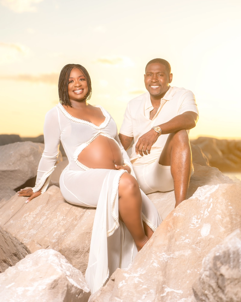 Expecting couple on a Tampa Bay beach, photographed by Captured By Mallary